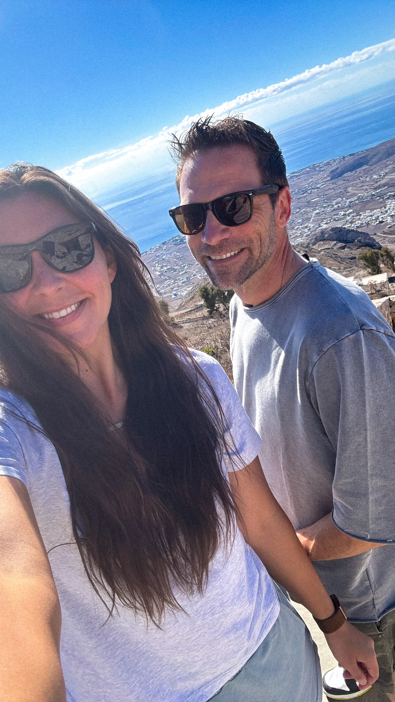 doug & dana selfie above the southern aegean sea in santorini, greece