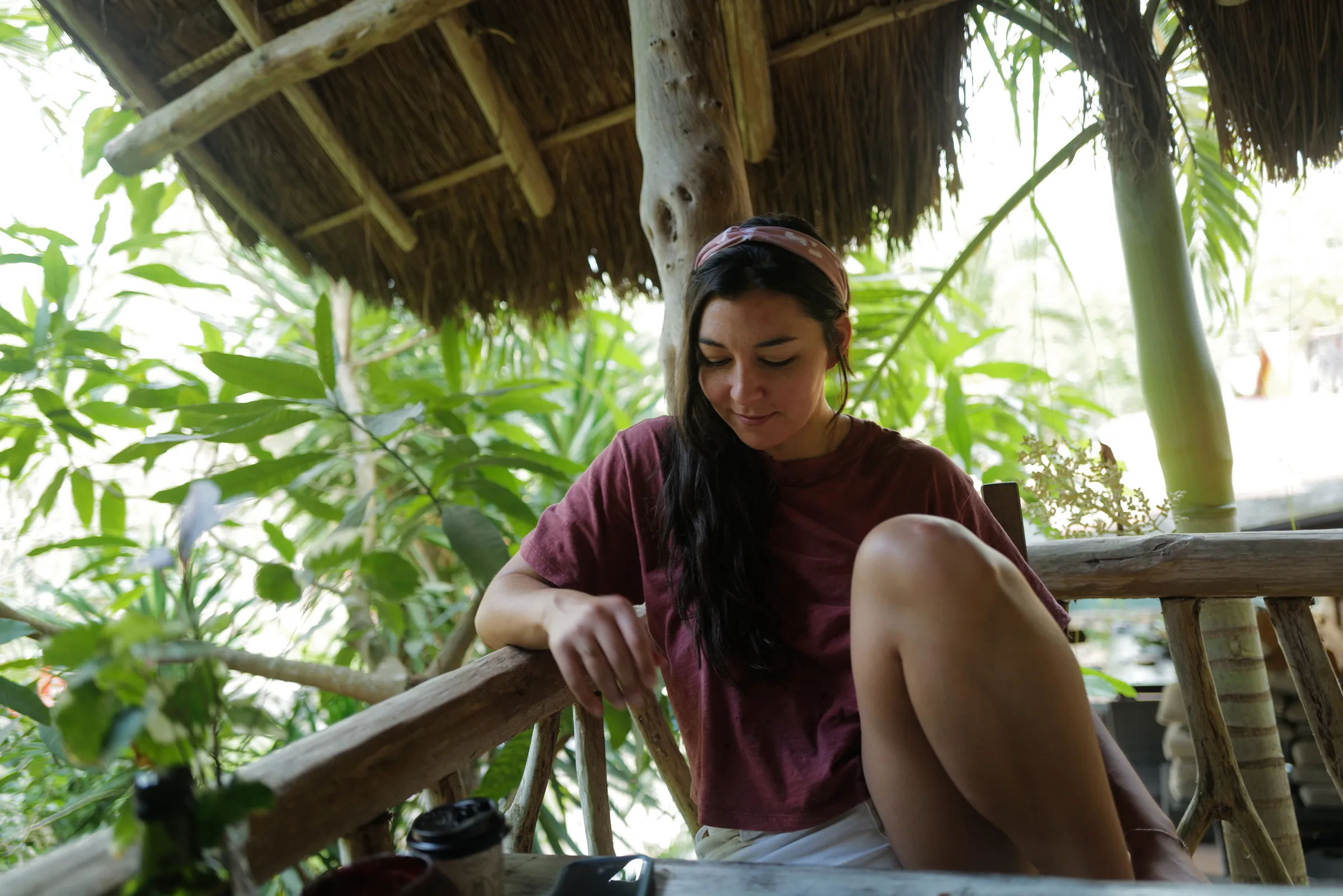 dana under a palapa in tulum, mexico